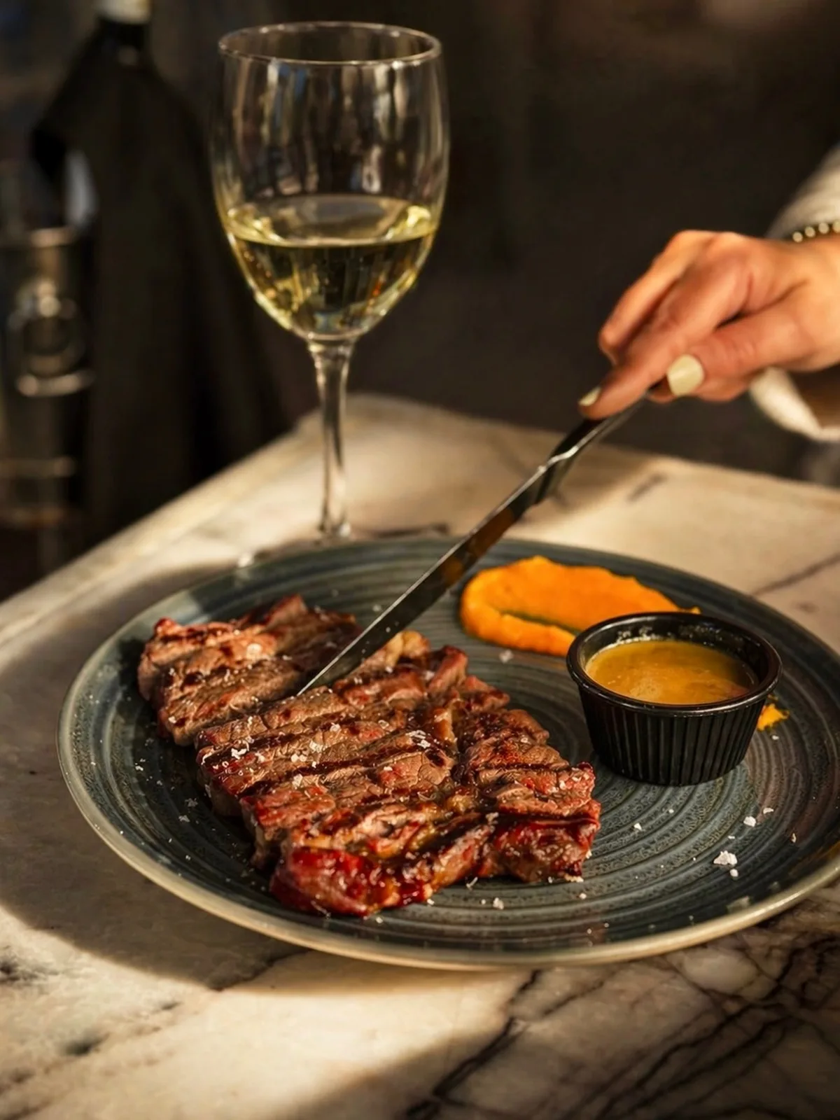 Premium Uruguay Angus Rib Eye, pure indulgence, perfected and paired with a crisp glass of white. This is how 